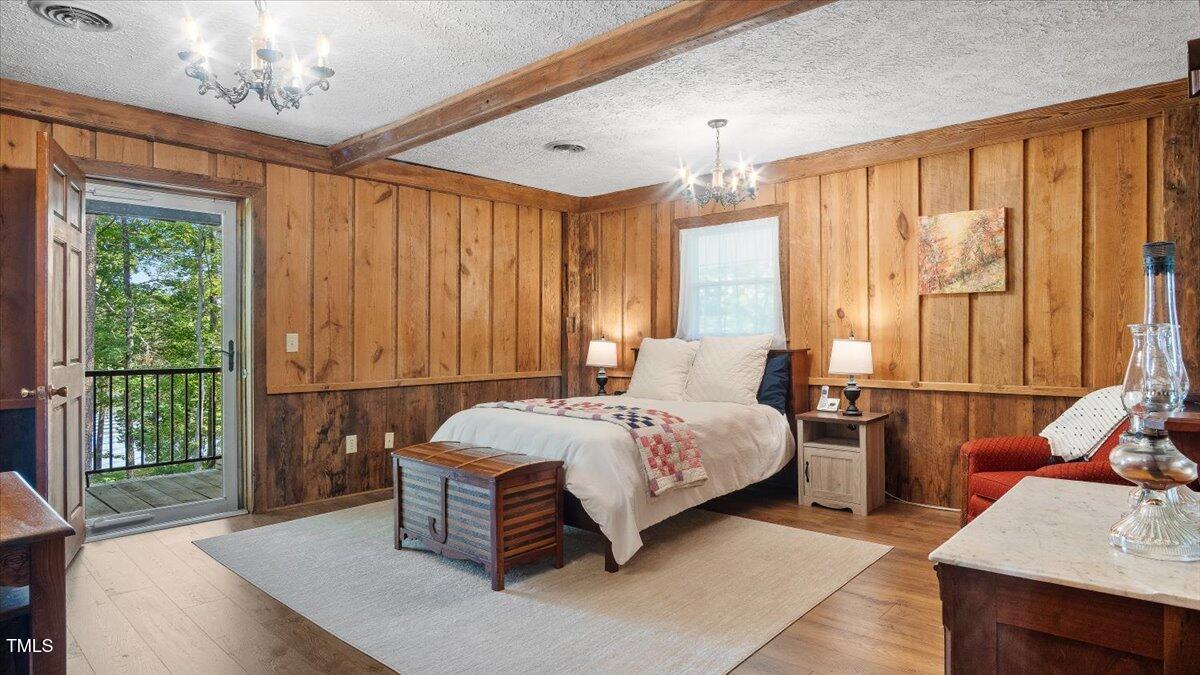 424 Roy Carver Road Semora, NC 27343 - Photo 34 of 68 a bedroom with a bed and a window