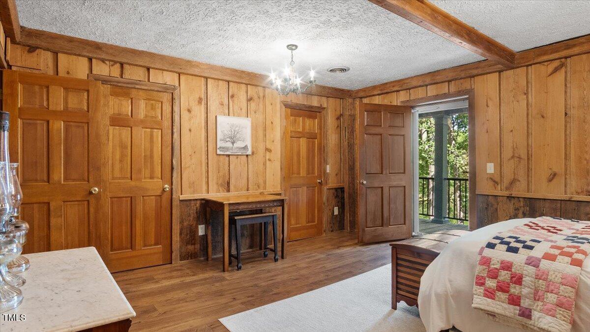 424 Roy Carver Road Semora, NC 27343 - Photo 35 of 68 a bedroom with furniture and a window