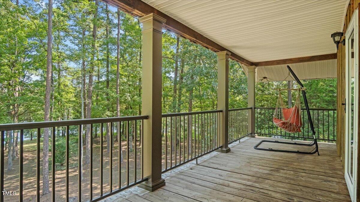 424 Roy Carver Road Semora, NC 27343 - Photo 36 of 68 a view of balcony with wooden floor