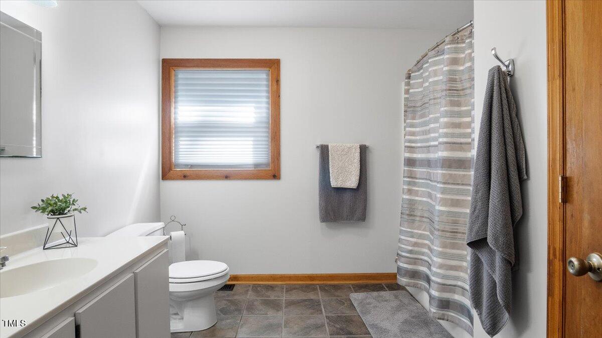 424 Roy Carver Road Semora, NC 27343 - Photo 46 of 68 a bathroom with a toilet and a shower