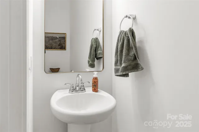 a bathroom with a sink and mirror