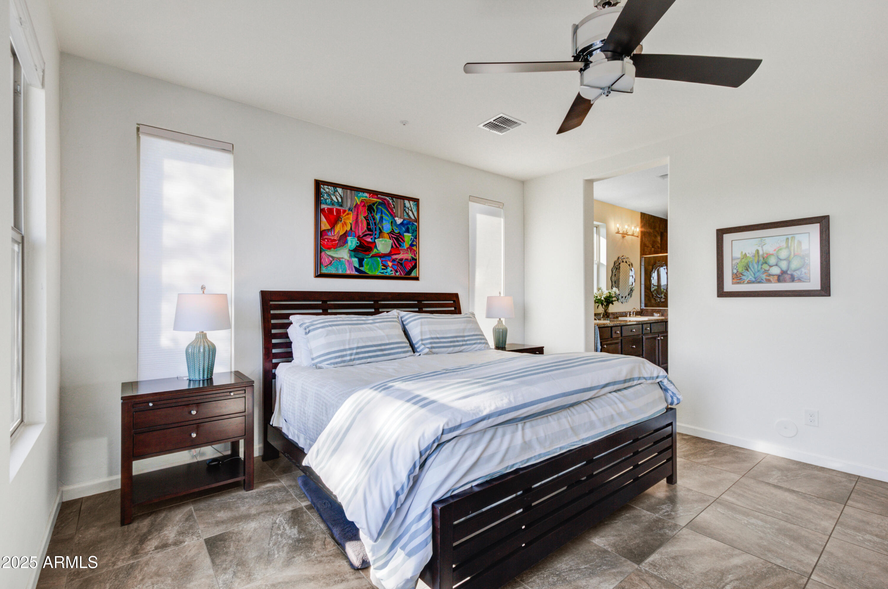 17919 East Slide Rock Drive Rio Verde, AZ 85263 - Photo 14 of 48 a bedroom with a bed and a painting on the wall