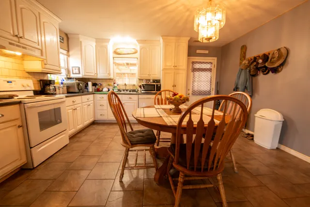 a view of a dining room with furniture window and outside view