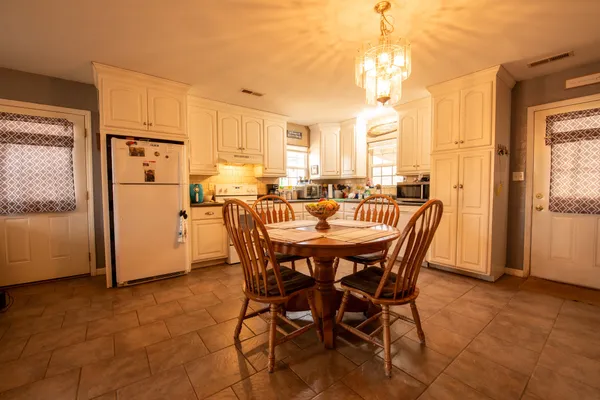 a view of a dining room with furniture window and outside view