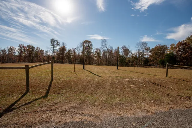 a view of yard with patio