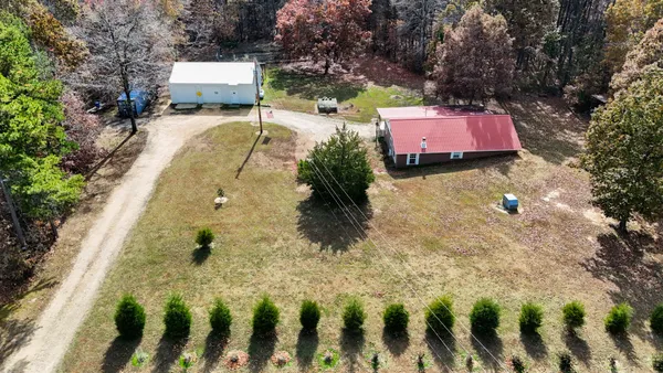 a view of a yard with table and chairs
