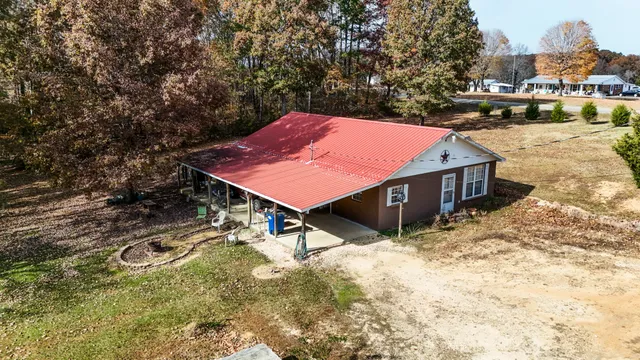 a view of a patio with a table and chairs