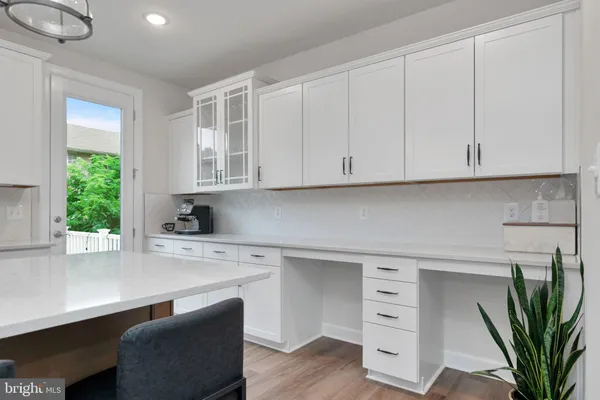 a kitchen with appliances cabinets and a window