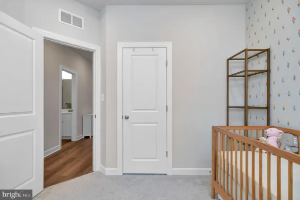 a view of a bedroom from a hallway