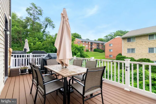 a view of a patio with a table and chairs