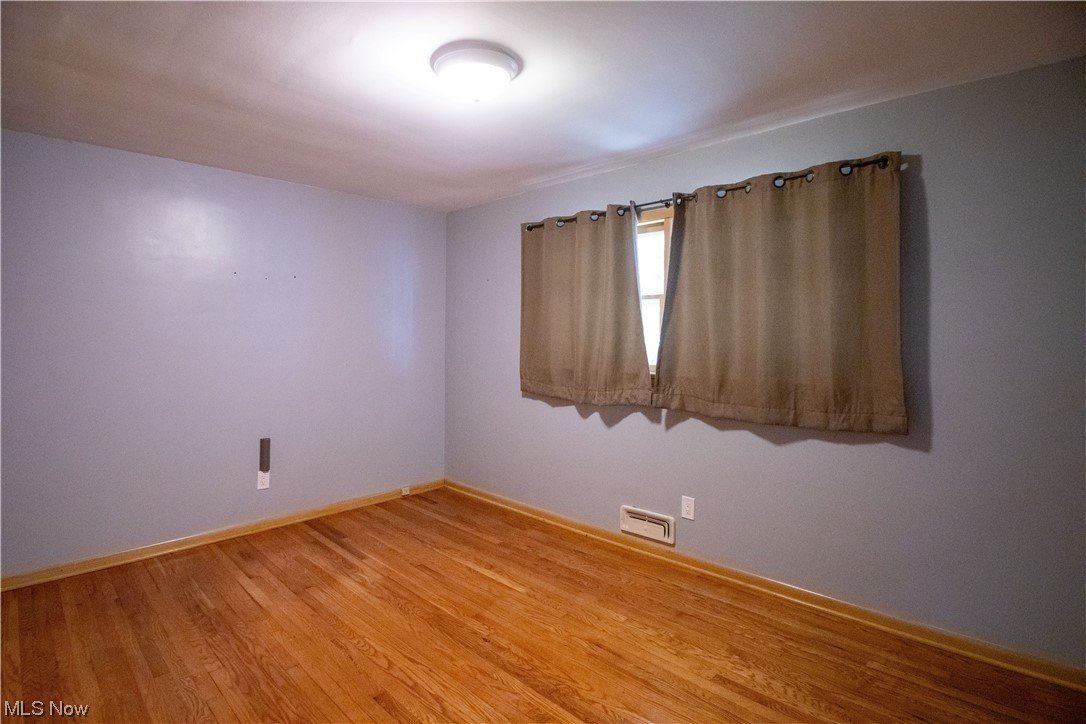 7674 Ragall Parkway Cleveland, OH 44130 - Photo 13 of 32 Spare room with wood-type flooring