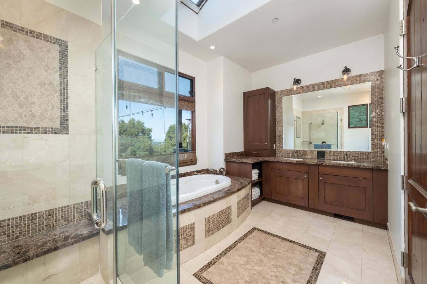 1036 Los Trancos Road Portola Valley, CA 94028 - Photo 11 of 33 a large bathroom with a double vanity sink a mirror and a shower
