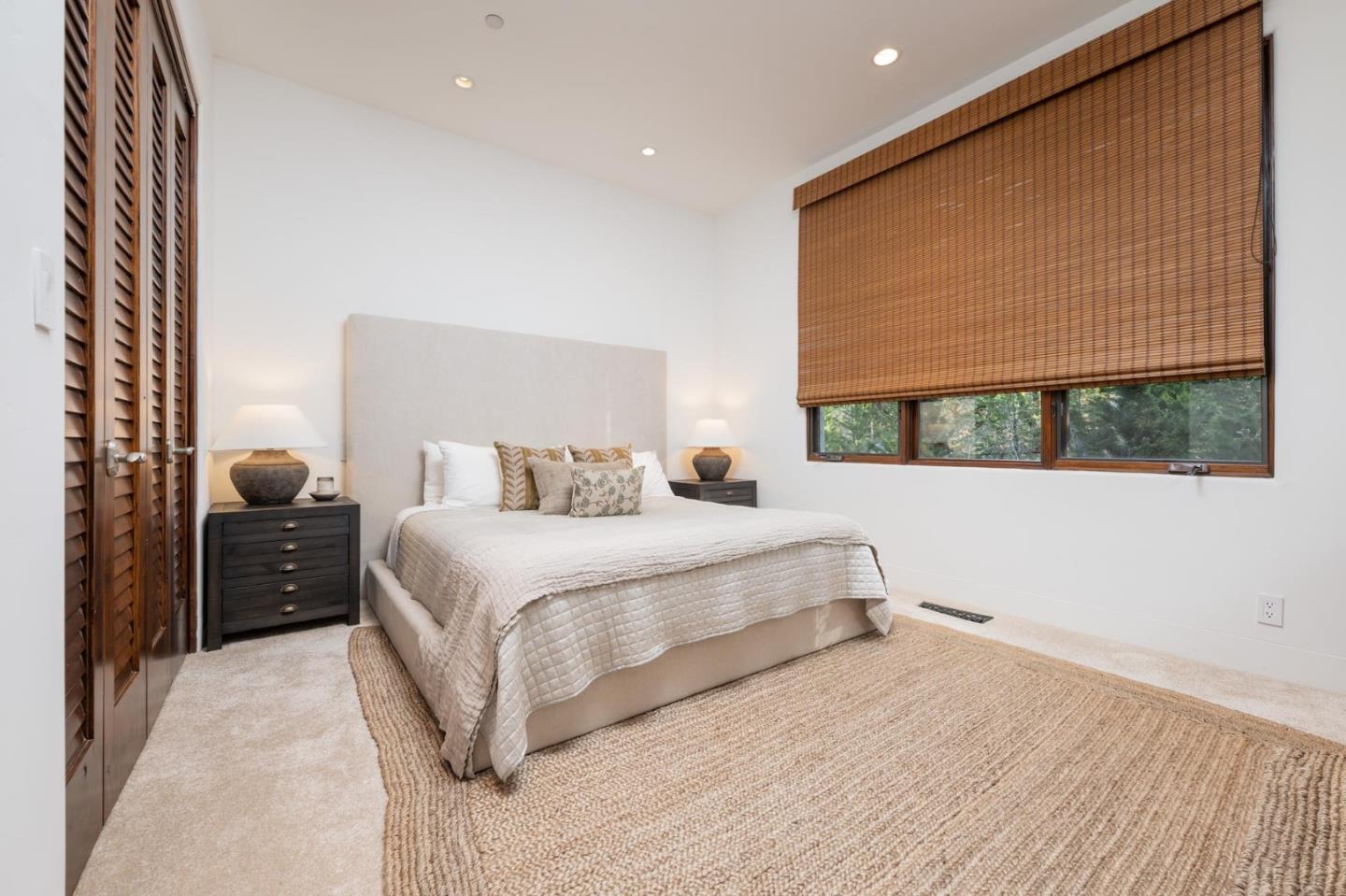 1036 Los Trancos Road Portola Valley, CA 94028 - Photo 13 of 33 a bedroom with a large bed and a large window