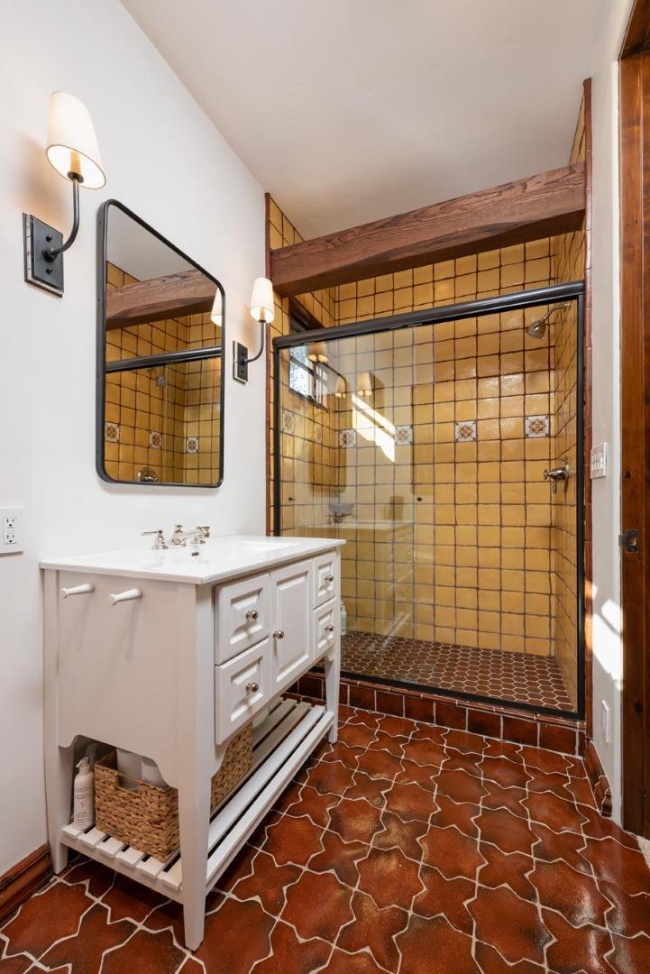 1036 Los Trancos Road Portola Valley, CA 94028 - Photo 14 of 33 a bathroom with a sink and a mirror