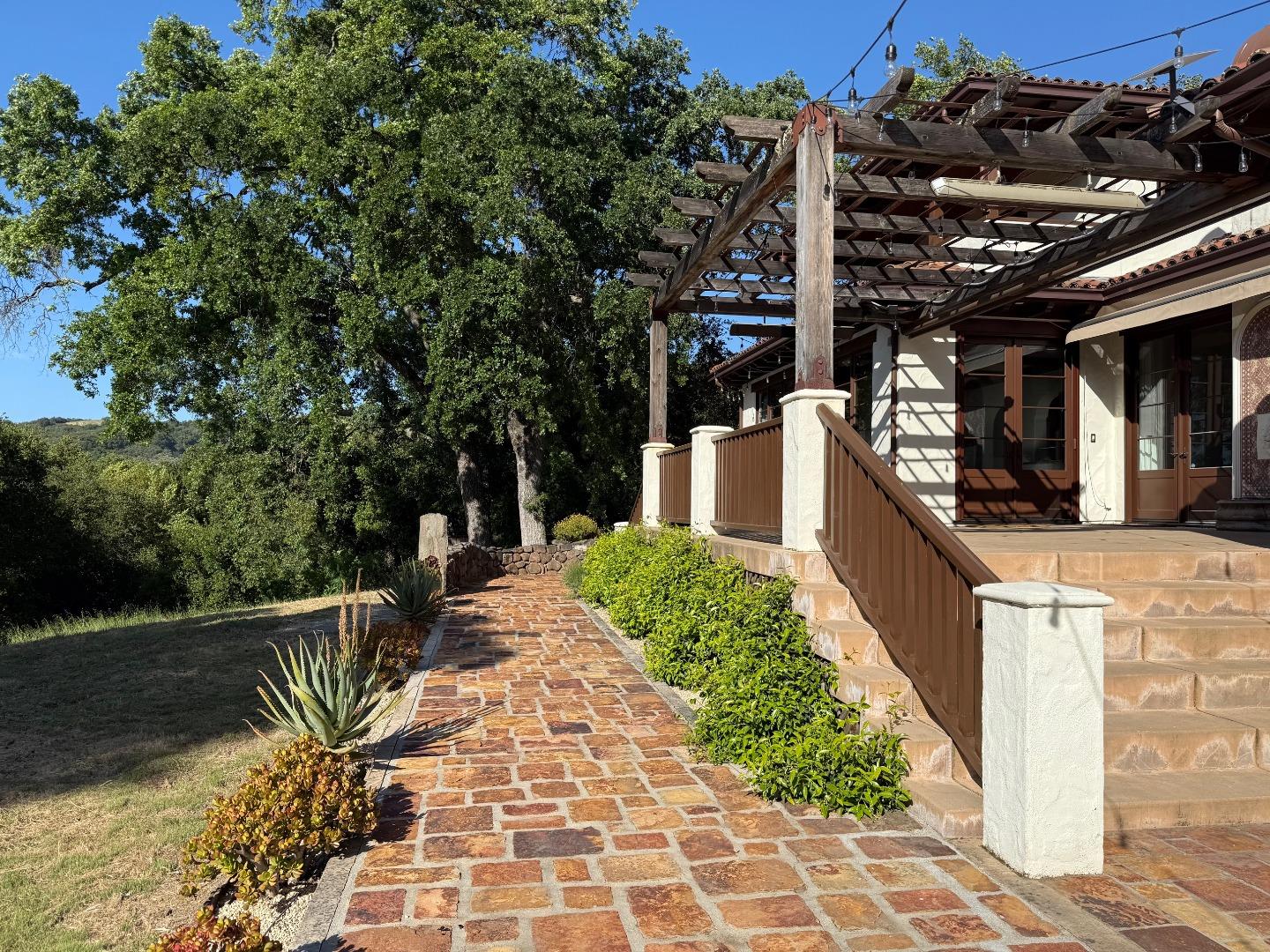 1036 Los Trancos Road Portola Valley, CA 94028 - Photo 23 of 33 a view of a house with backyard and sitting area