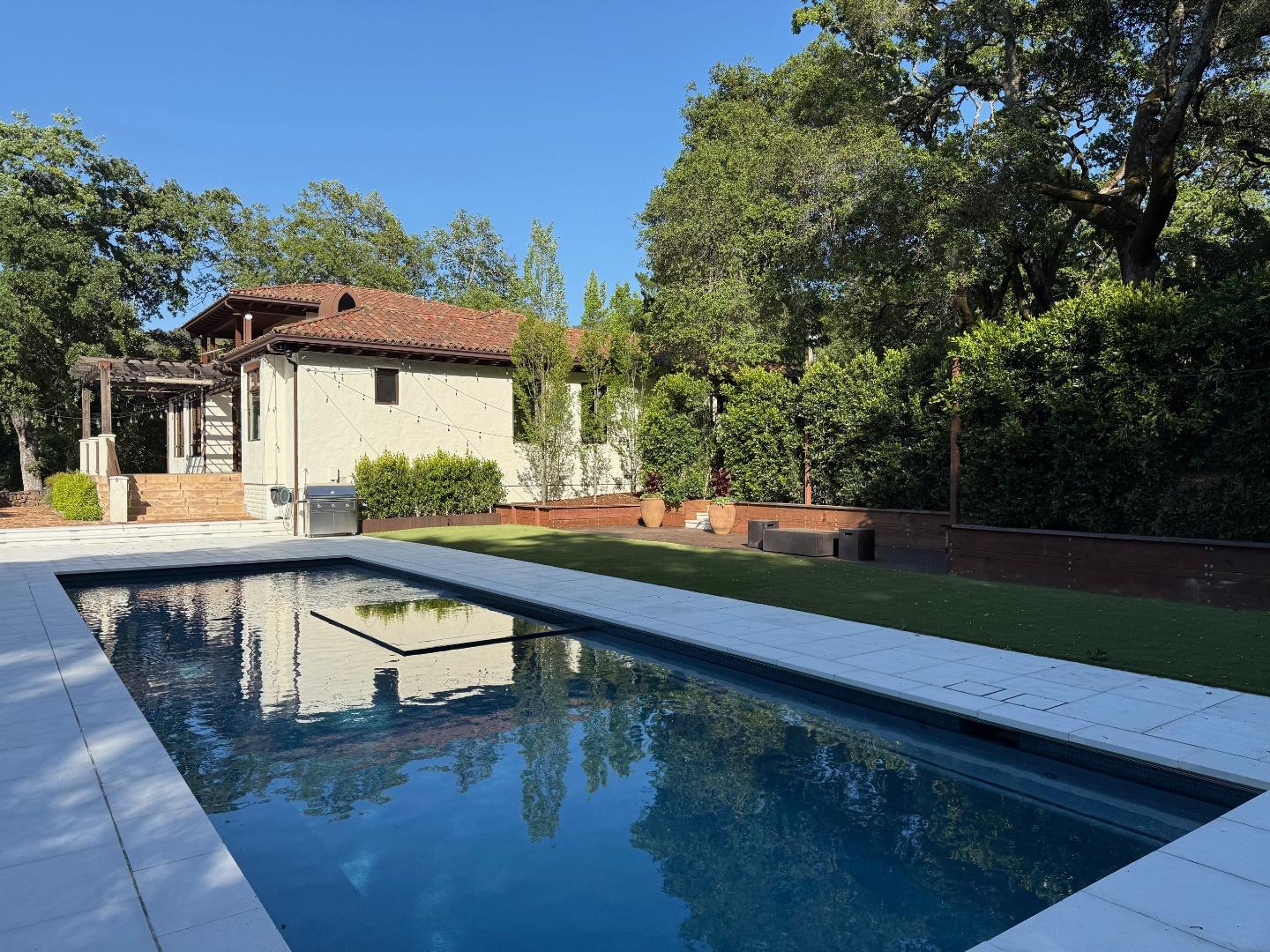 1036 Los Trancos Road Portola Valley, CA 94028 - Photo 24 of 33 a view of a swimming pool with a patio