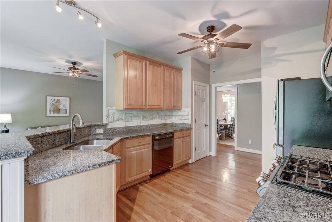 5501 Pine Needles Terrace Providence Forge, VA 23140 - Photo 14 of 50 a kitchen with stainless steel appliances granite countertop a sink refrigerator and cabinets