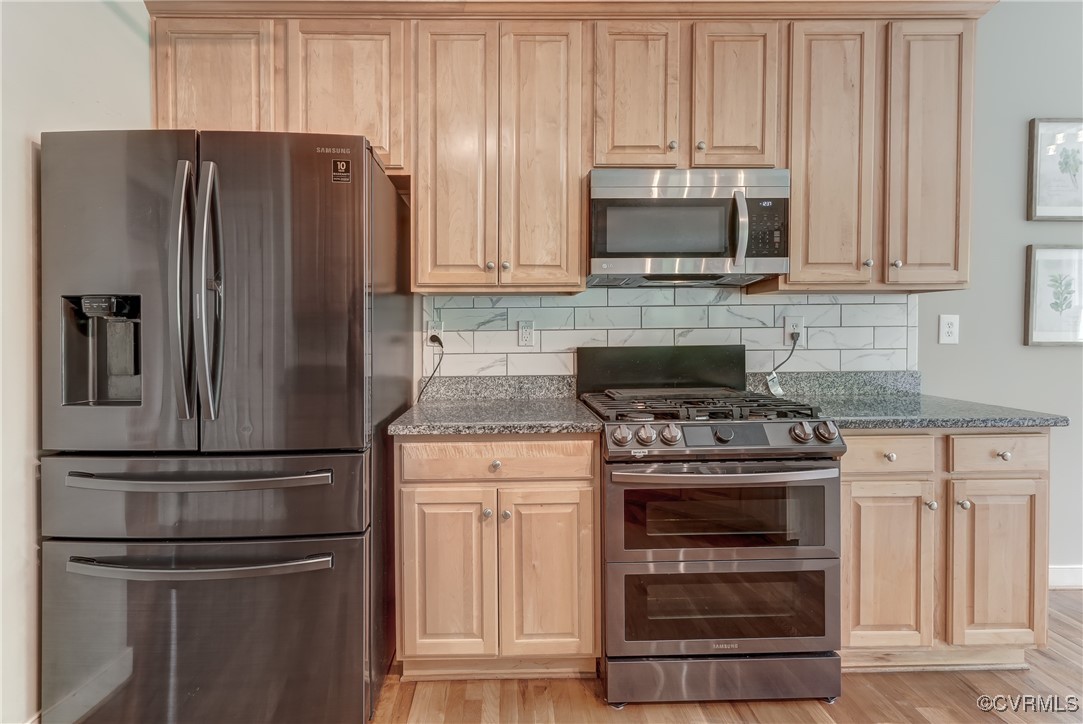 5501 Pine Needles Terrace Providence Forge, VA 23140 - Photo 15 of 50 a kitchen with stainless steel appliances granite countertop a refrigerator stove and sink