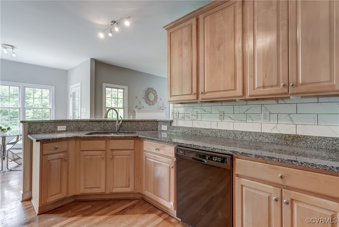 5501 Pine Needles Terrace Providence Forge, VA 23140 - Photo 16 of 50 a kitchen with granite countertop stainless steel appliances white cabinets granite counter tops and a wooden floors