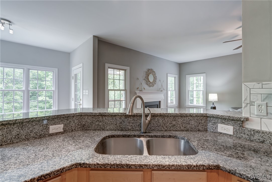 5501 Pine Needles Terrace Providence Forge, VA 23140 - Photo 19 of 50 a kitchen with granite countertop a sink and a window