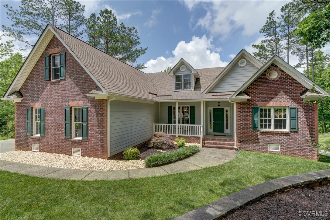 5501 Pine Needles Terrace Providence Forge, VA 23140 - Photo 2 of 50 a front view of a house with a yard and porch