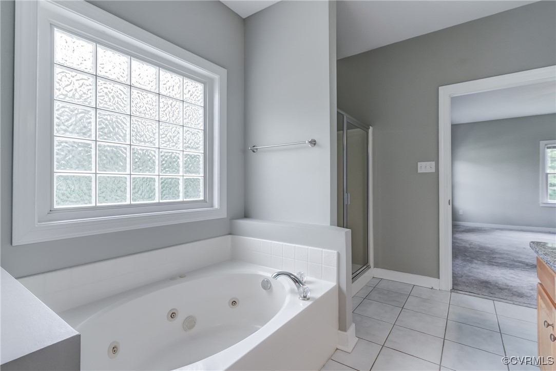 5501 Pine Needles Terrace Providence Forge, VA 23140 - Photo 24 of 50 a white bath tub sitting next to a window
