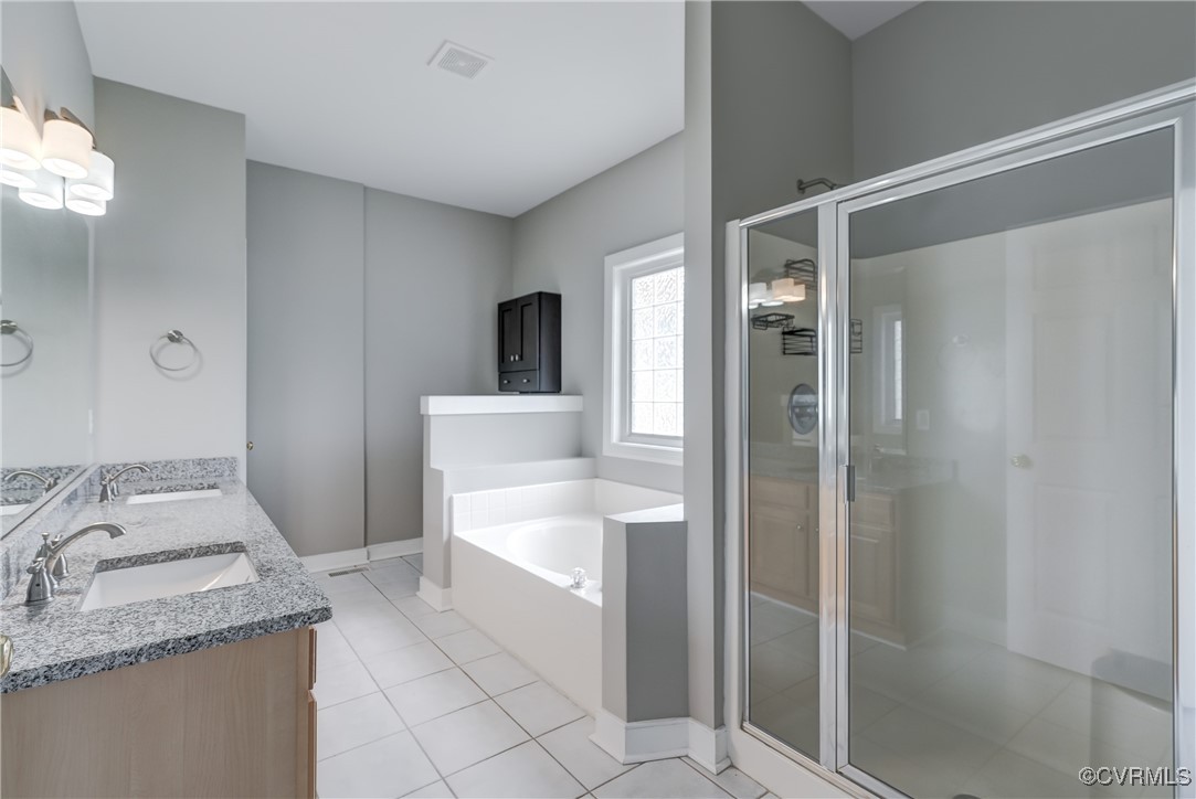 5501 Pine Needles Terrace Providence Forge, VA 23140 - Photo 25 of 50 a bathroom with a granite countertop sink and a mirror