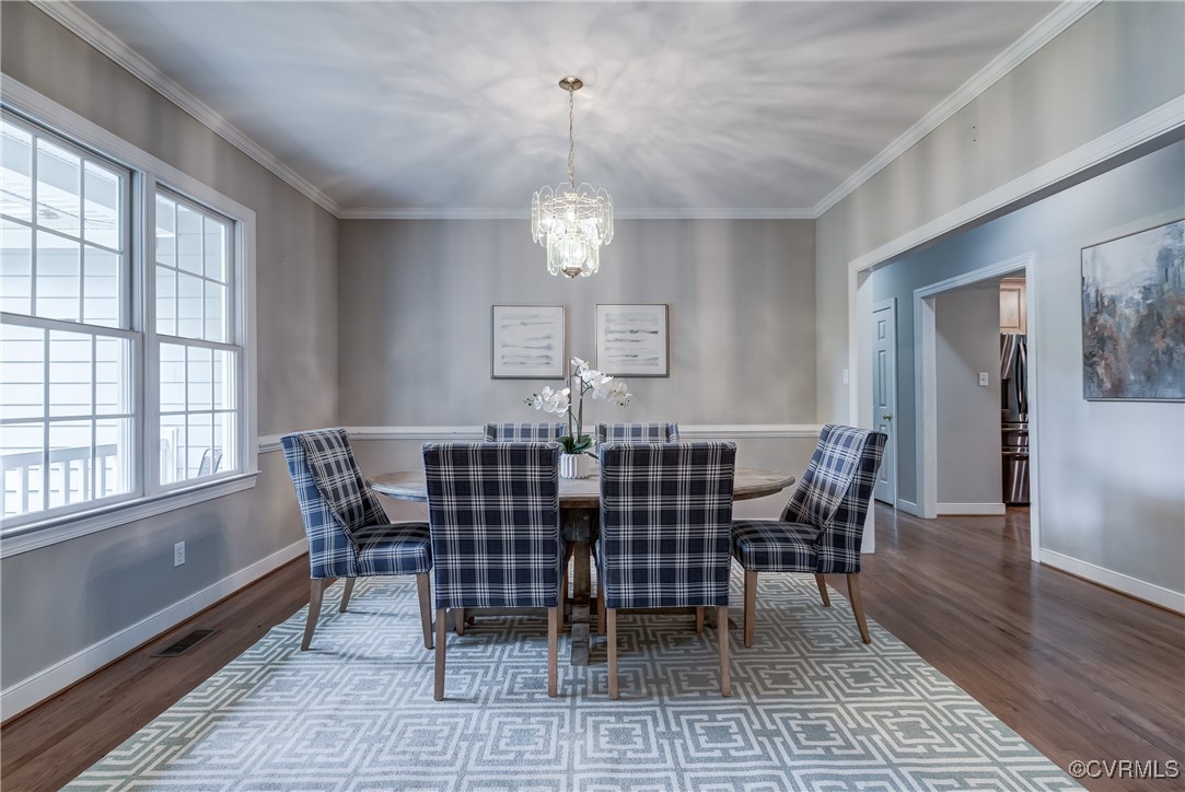 5501 Pine Needles Terrace Providence Forge, VA 23140 - Photo 4 of 50 a view of a dining room with furniture window and wooden floor