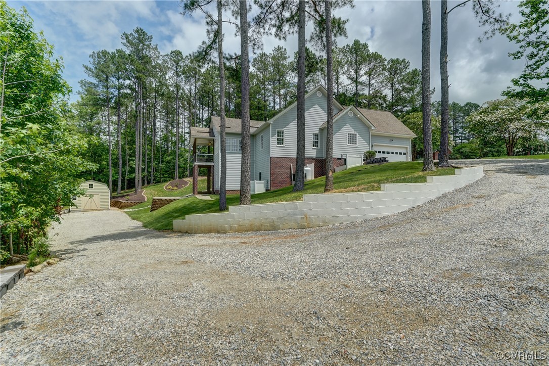 5501 Pine Needles Terrace Providence Forge, VA 23140 - Photo 45 of 50 a view of a house with a yard and large trees
