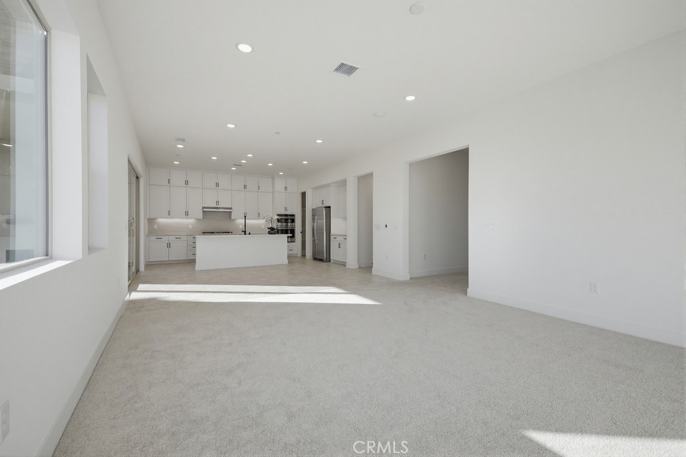 452 Botanica Rancho Mission Viejo, CA 92694 - Photo 14 of 53 a view of a kitchen with a refrigerator and a window