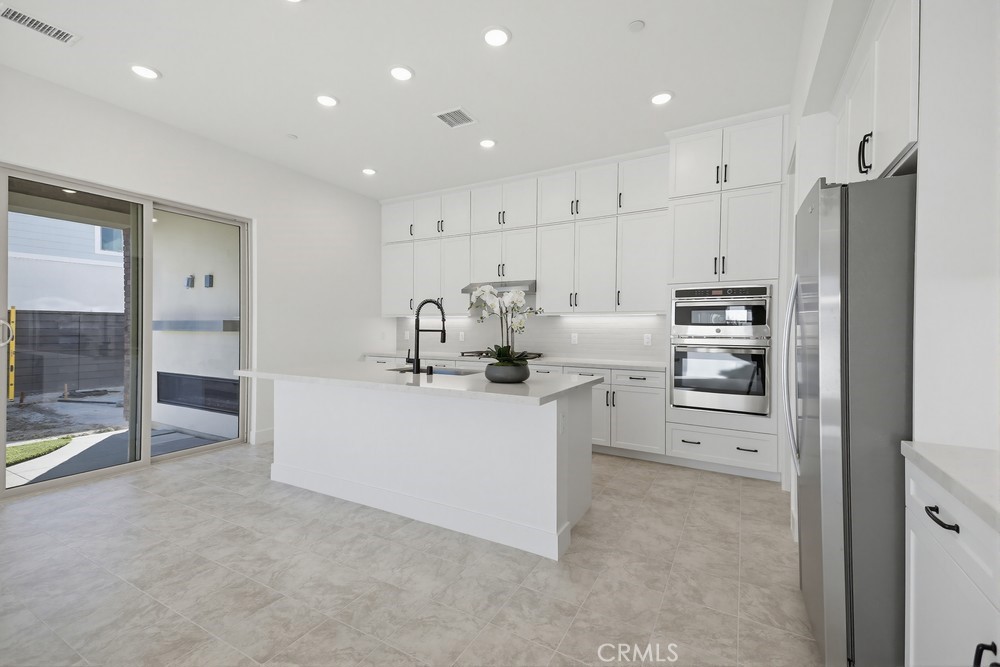 452 Botanica Rancho Mission Viejo, CA 92694 - Photo 19 of 53 a kitchen with refrigerator and cabinets