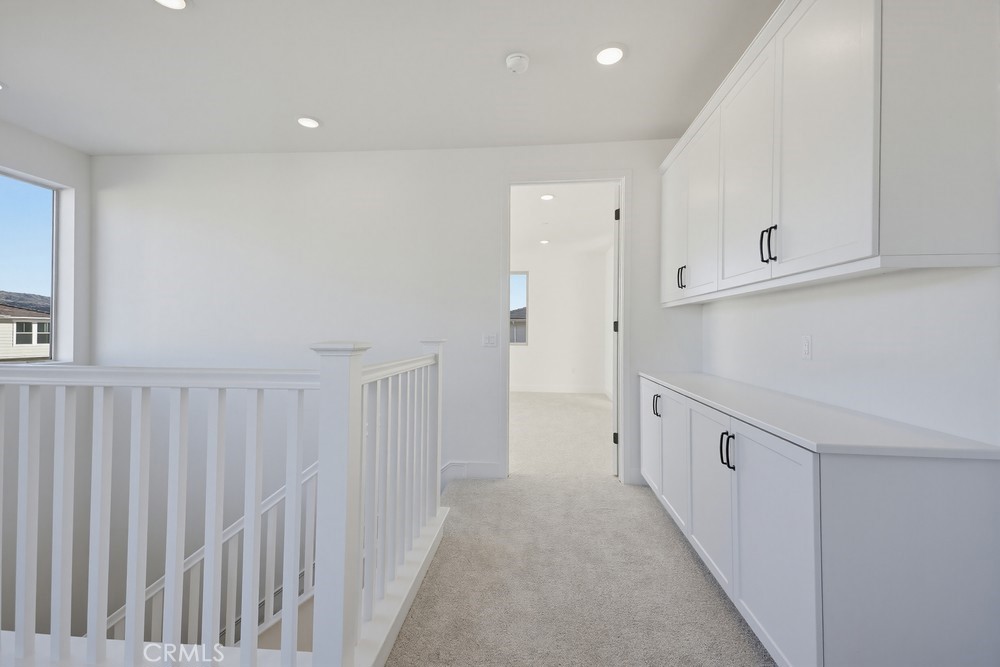 452 Botanica Rancho Mission Viejo, CA 92694 - Photo 25 of 53 a view of a hallway with white cabinets