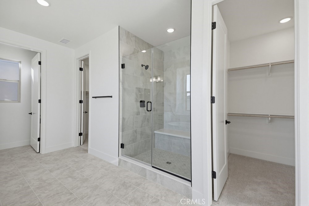 452 Botanica Rancho Mission Viejo, CA 92694 - Photo 28 of 53 a bathroom with a shower and a glass door