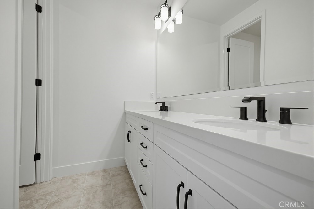 452 Botanica Rancho Mission Viejo, CA 92694 - Photo 36 of 53 a bathroom with a sink vanity and mirror