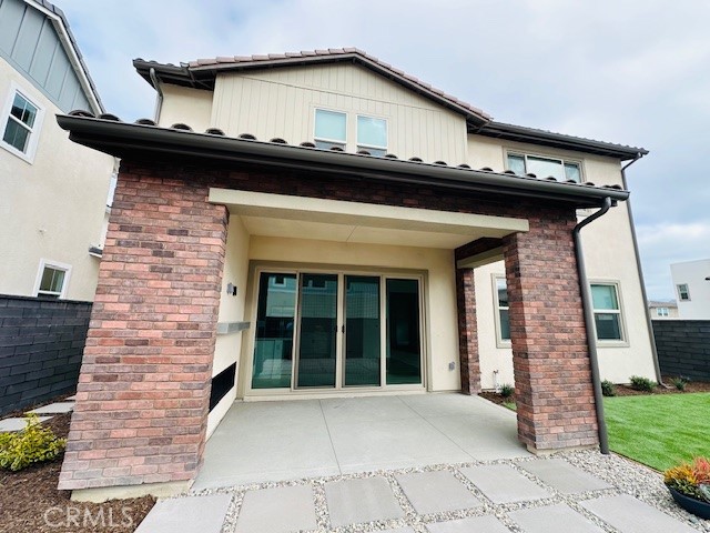 452 Botanica Rancho Mission Viejo, CA 92694 - Photo 46 of 53 a view of a brick house with a large window