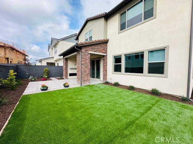 452 Botanica Rancho Mission Viejo, CA 92694 - Photo 49 of 53 a front view of a house with a garden