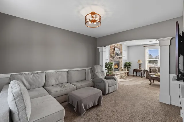 a living room with furniture and a table