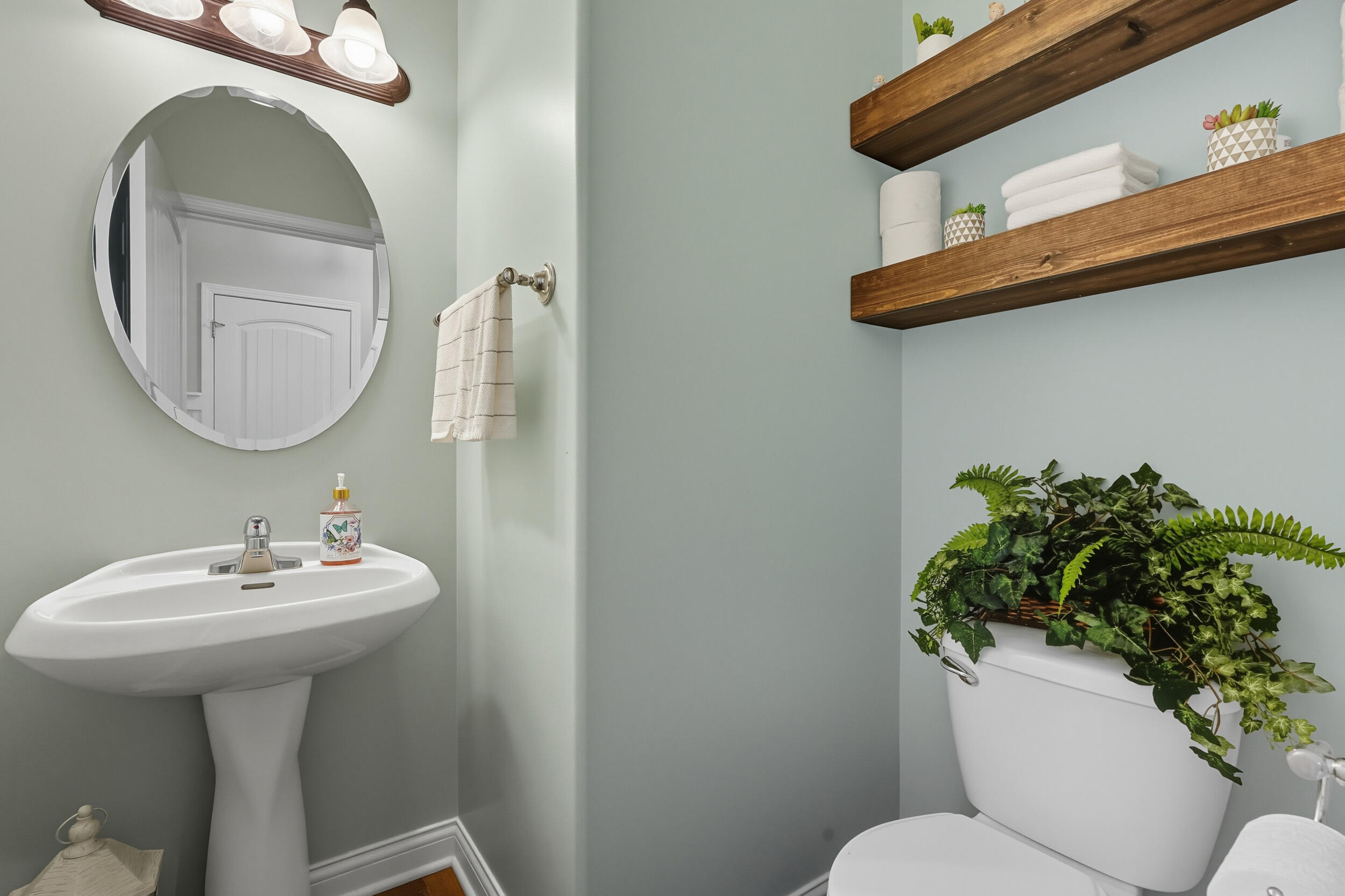 3353 Field Hawk Drive Valparaiso, IN 46383 - Photo 12 of 33 a bathroom with a toilet sink and mirror