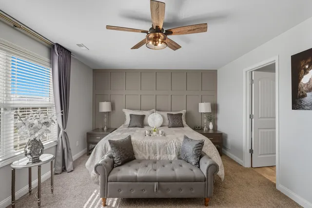 a bedroom with a bed and couch