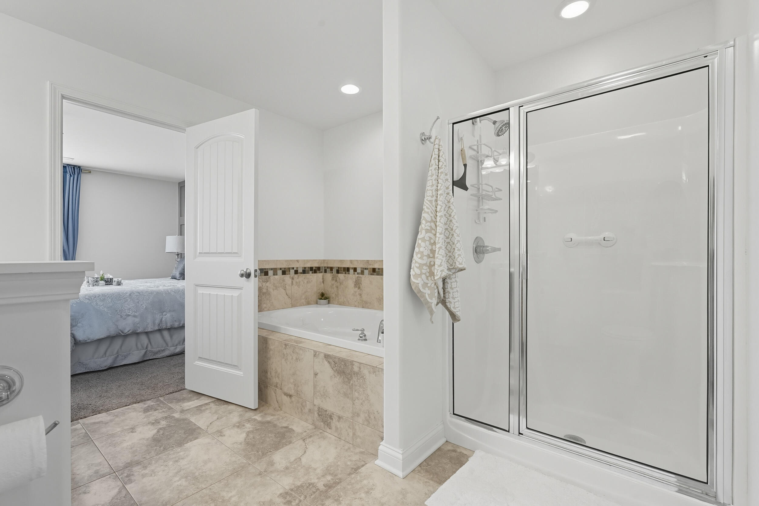 3353 Field Hawk Drive Valparaiso, IN 46383 - Photo 18 of 33 a bathroom with a bathtub and a shower
