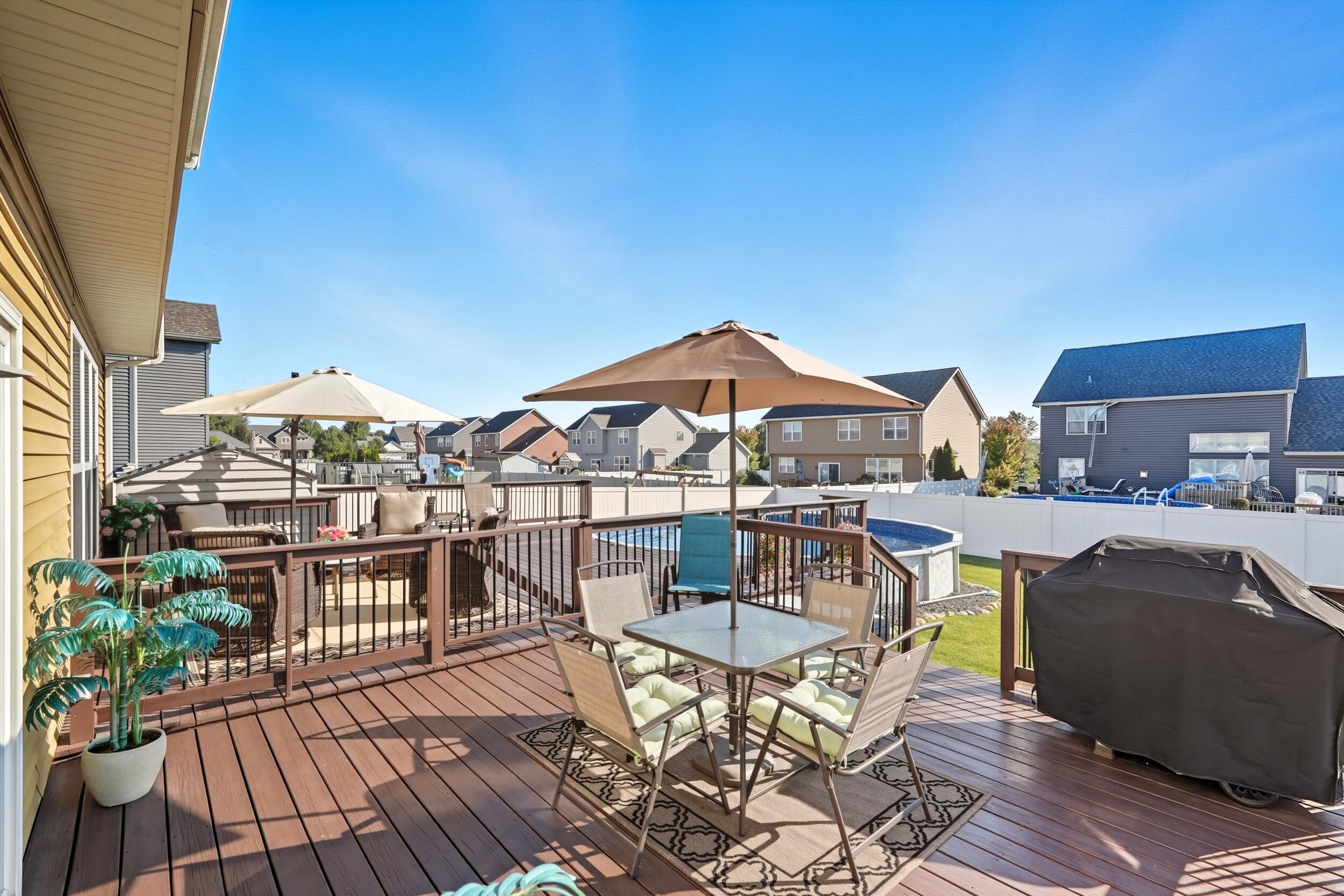 3353 Field Hawk Drive Valparaiso, IN 46383 - Photo 27 of 33 a view of a roof deck with table and chairs barbeque oven with wooden floor