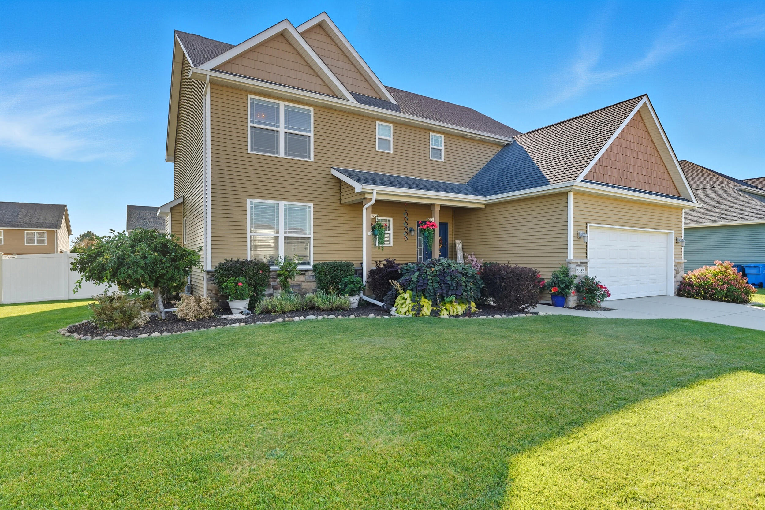3353 Field Hawk Drive Valparaiso, IN 46383 - Photo 32 of 33 a front view of a house with a yard and garage