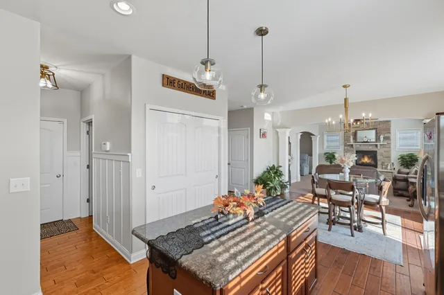 a living room with dining table and a wooden floor