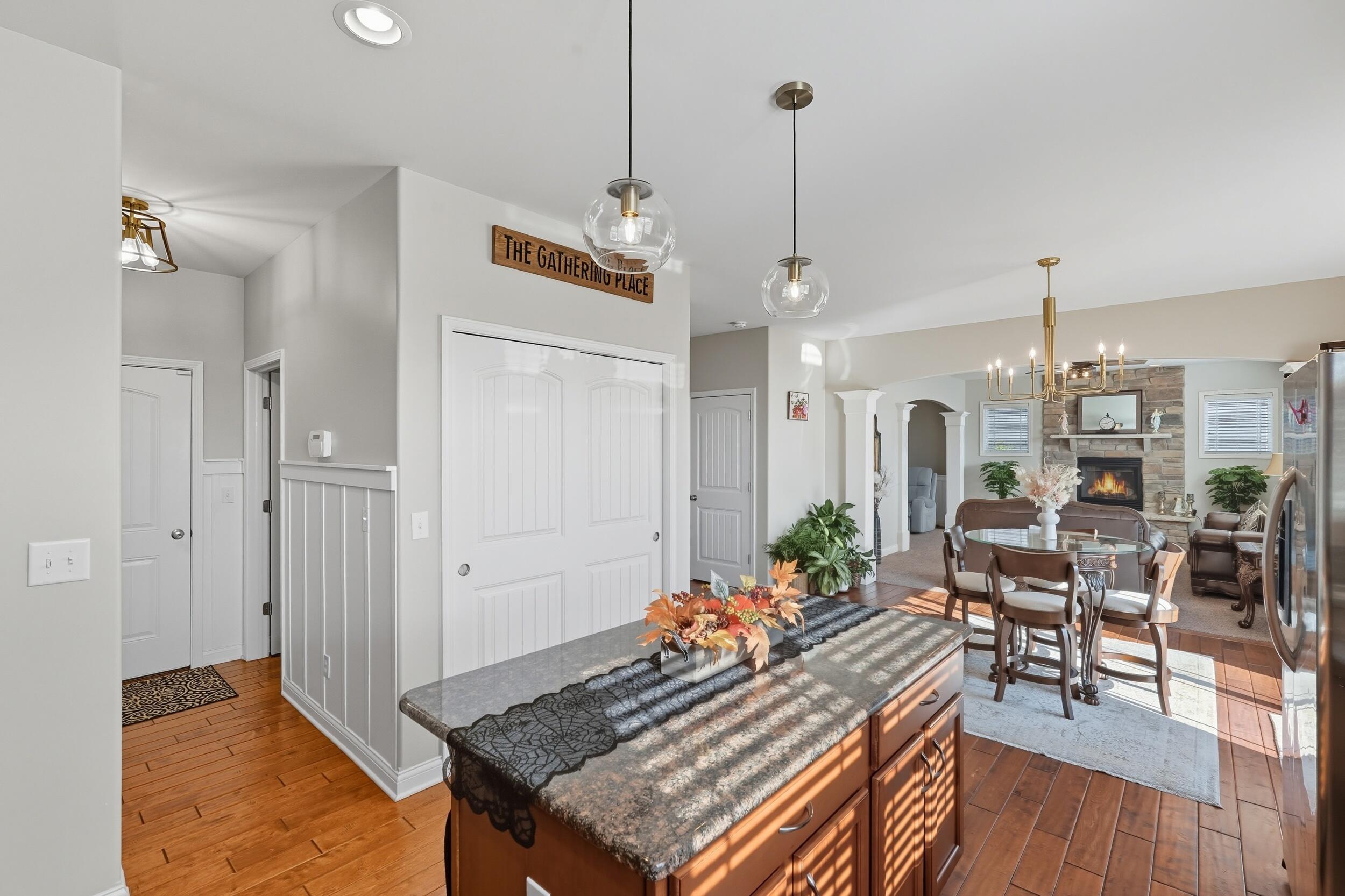 3353 Field Hawk Drive Valparaiso, IN 46383 - Photo 6 of 33 a living room with dining table and a wooden floor