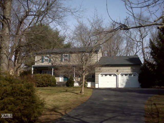 8 Blackberry Road Trumbull, CT 06611 - Photo 1 of 1 a front view of a house with parking