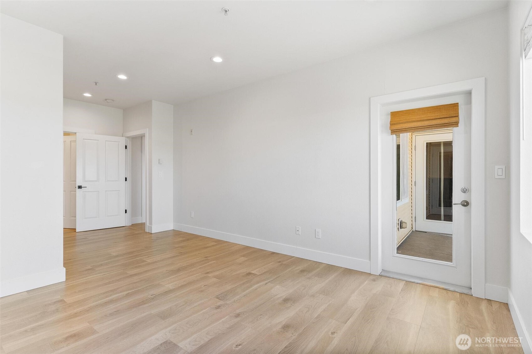 14915 38th Drive Southeast, Unit F3011 Bothell, WA 98012 - Photo 14 of 40 wooden floor in an empty room with a window