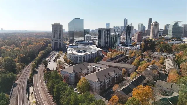 a view of living room with furniture and a fireplace