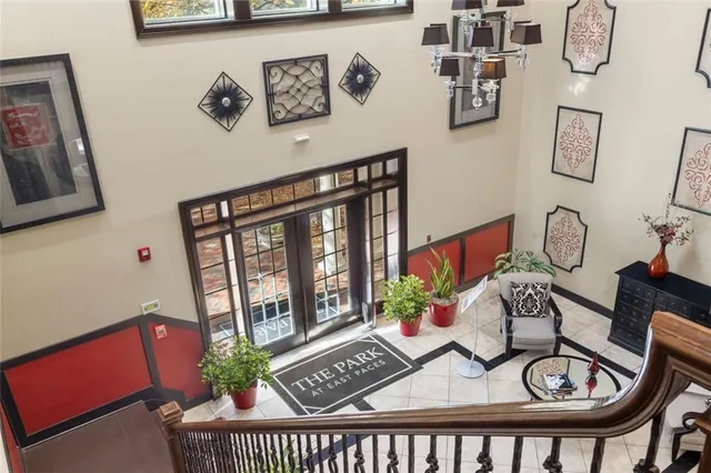a lobby with furniture and flowers