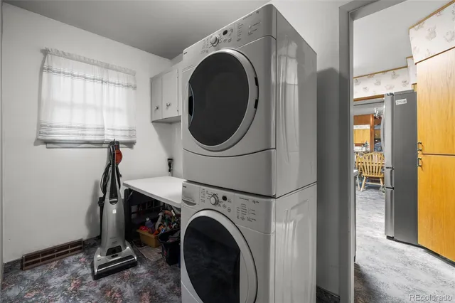 a view of livingroom with washer and dryer