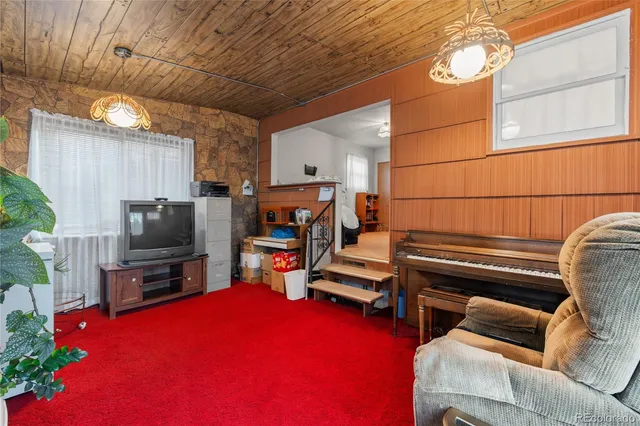 a room with furniture and a flat screen tv